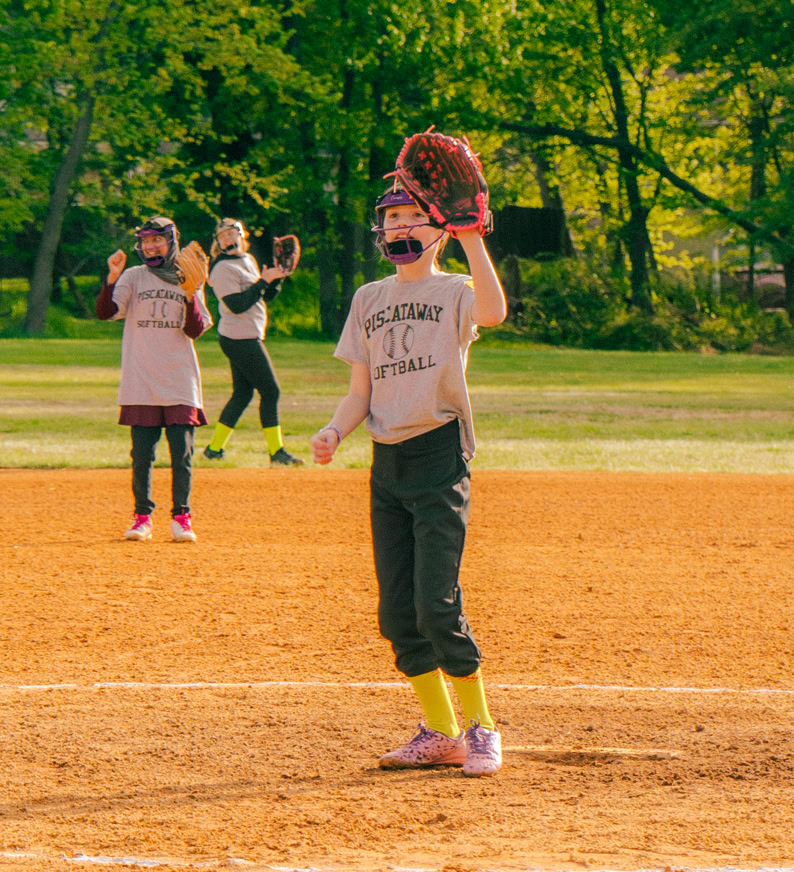 Softball player catching a throw